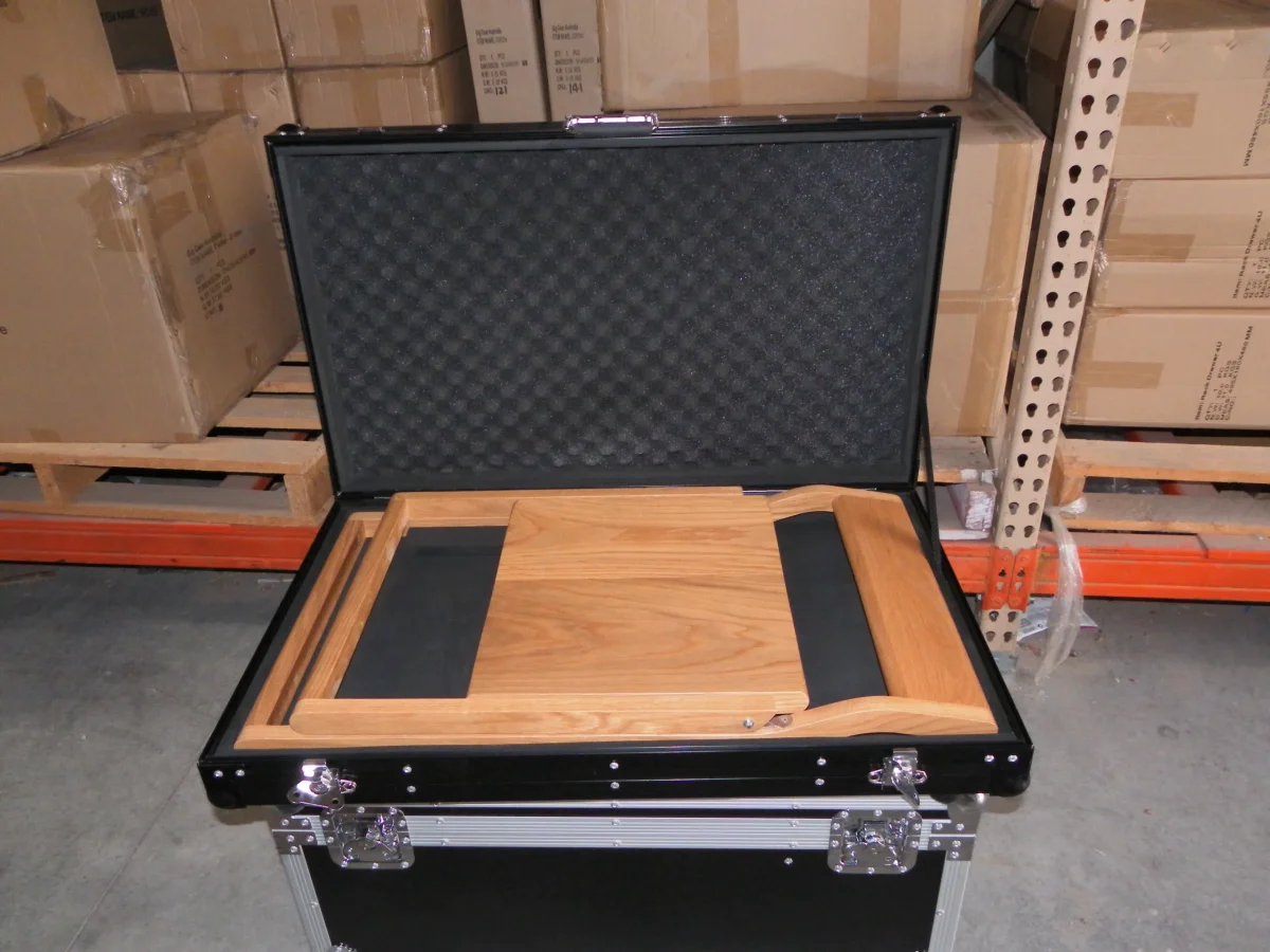 Open flight case with a shaped timber presentation tray seated inside the base
