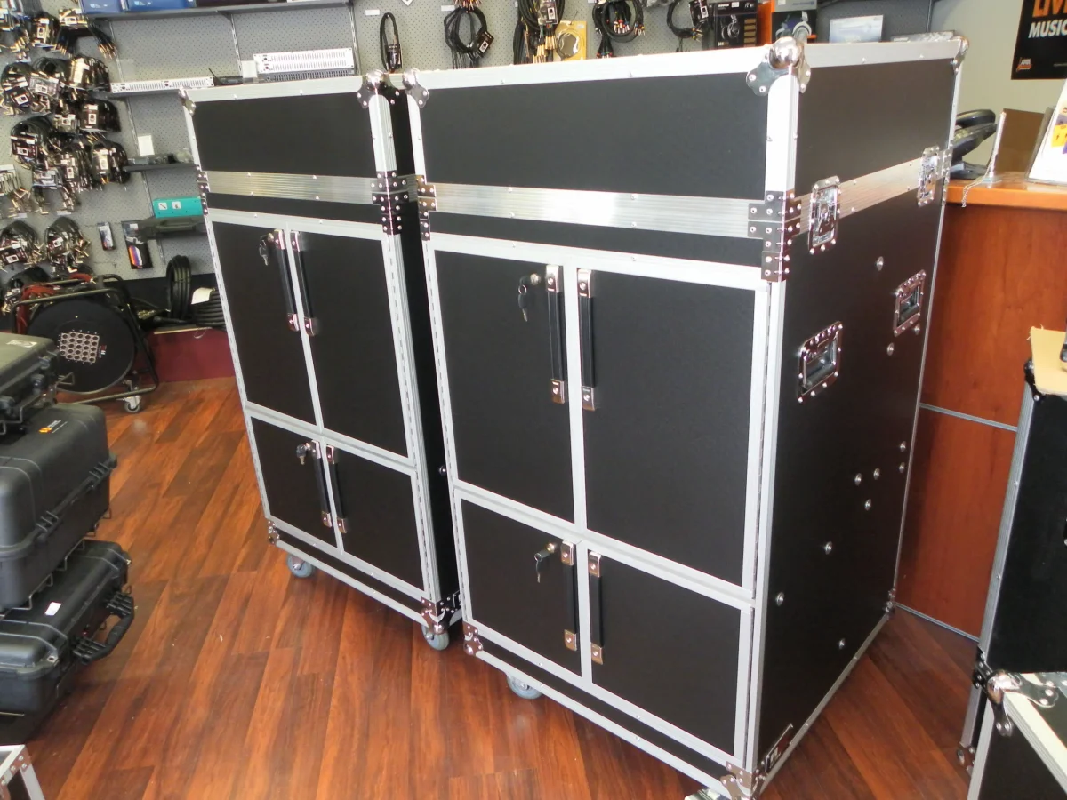 Two tall road case cabinets with lockable double doors on castors, built for AV storage