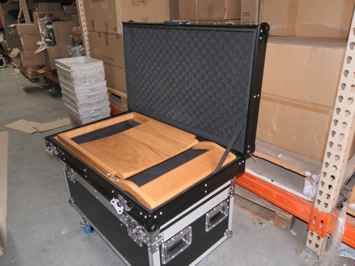 Flight case opened to a timber lectern top over a foam lined lid