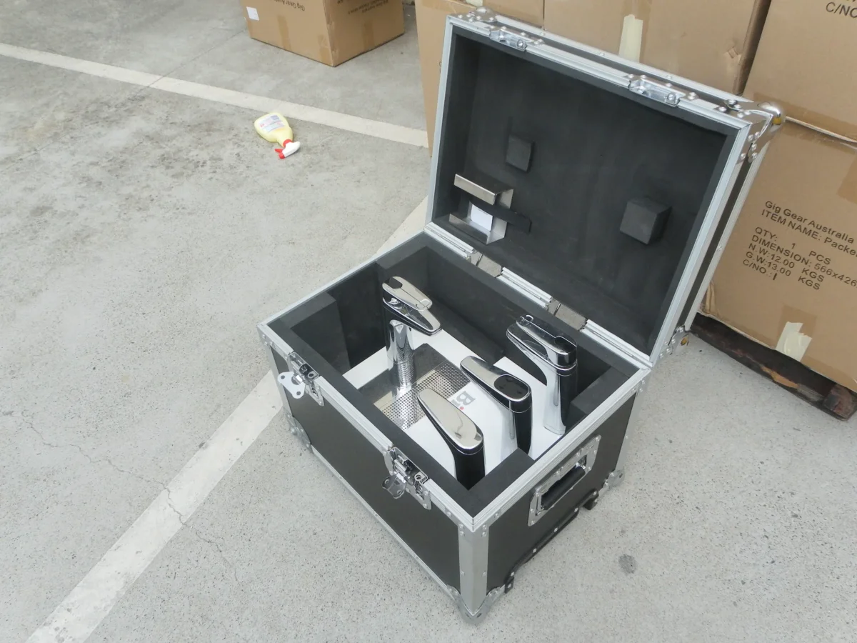 Black case with foam blocks cut to hold chrome retail display stands upright