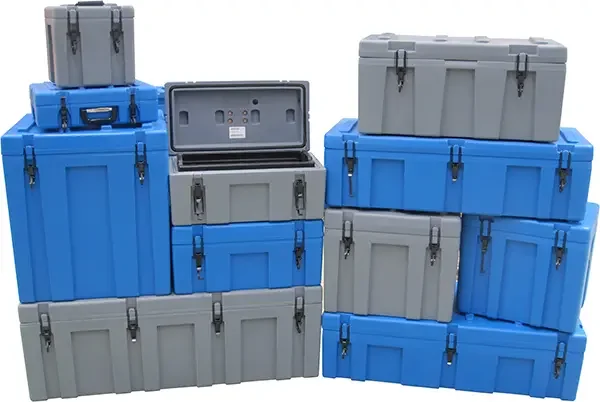Wall of blue and grey Spacecases across the size range, one open showing the lid seal