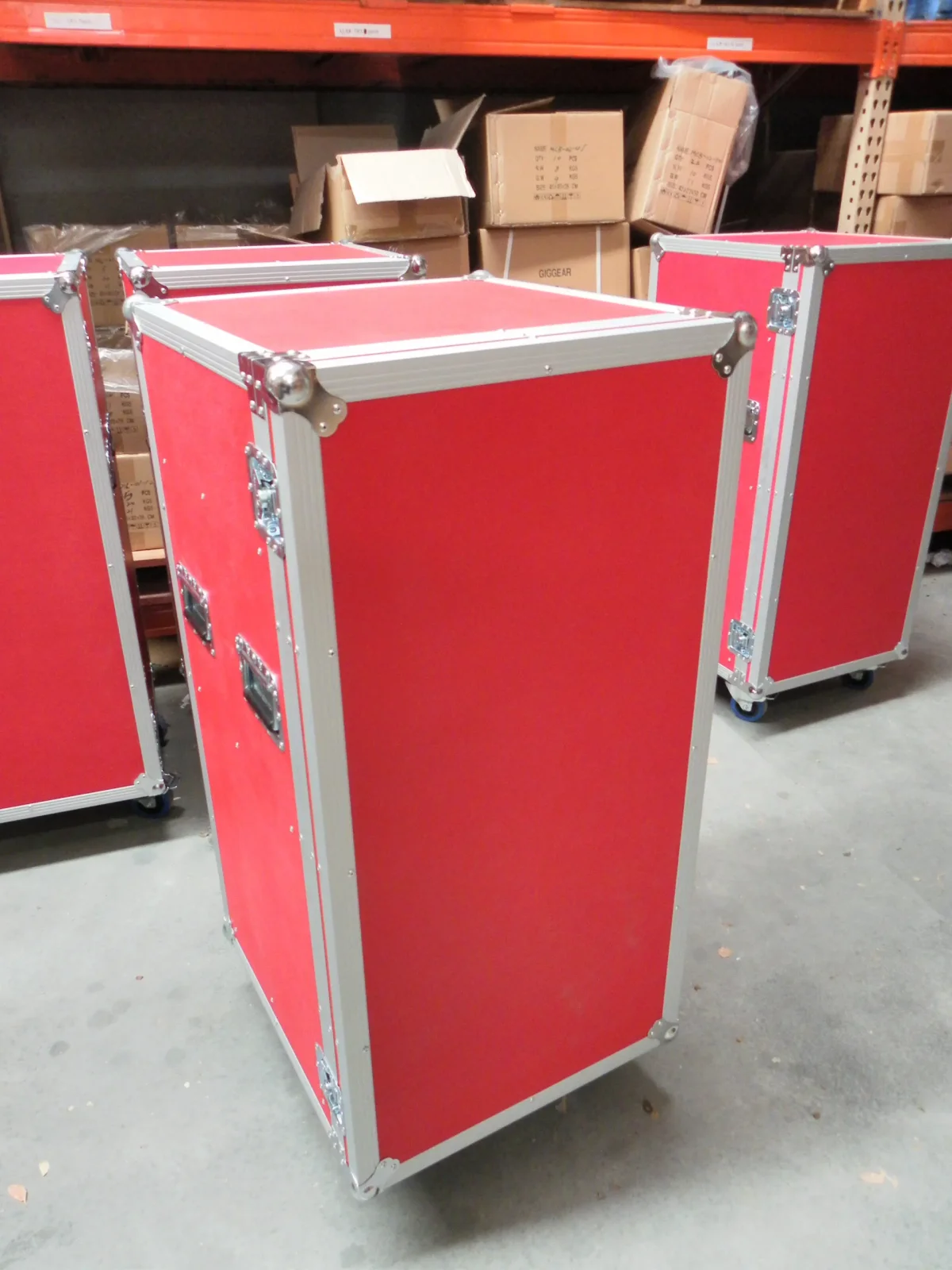 Red laminate road case cabinets in the warehouse, aluminium extrusion and chrome ball corners