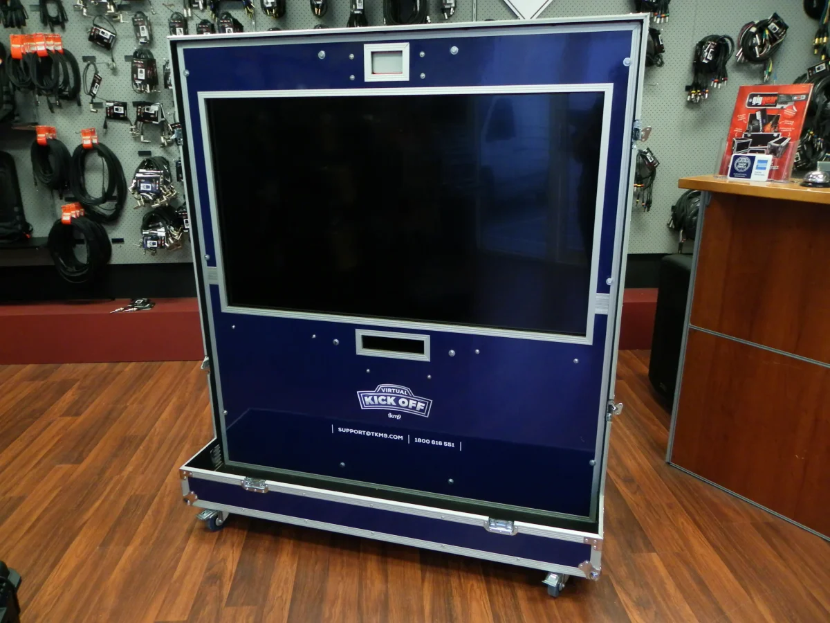 Navy road case opened out into a floor-standing large screen display stand