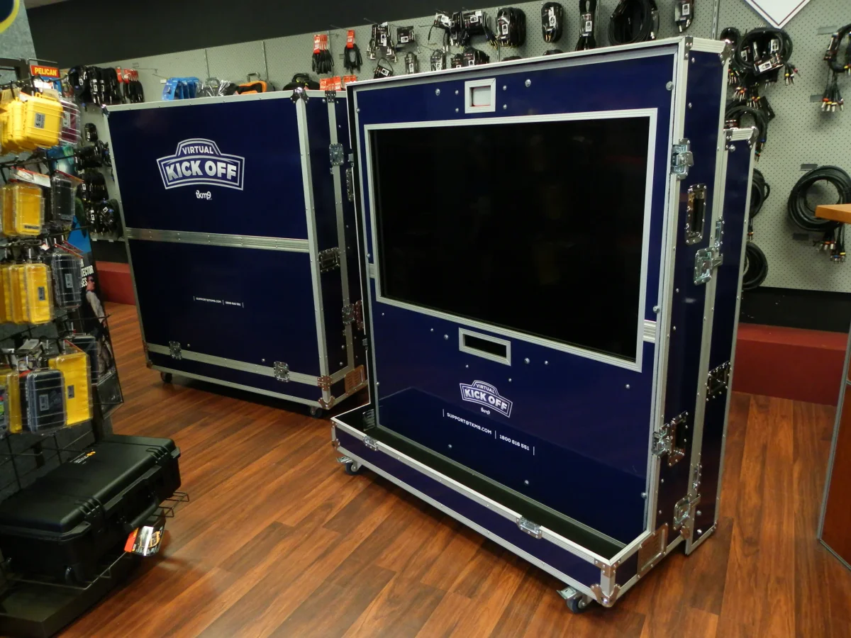 Two navy Virtual Kick Off cases, one open around its mounted display panel