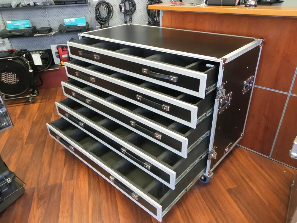 Road case with five drawers extended, each divided into labelled compartments