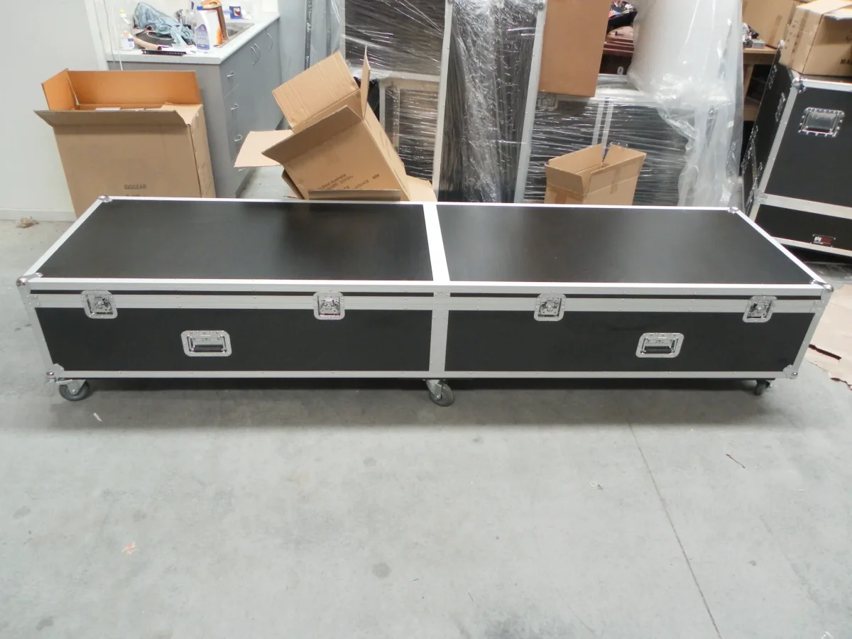 Long twin-lid road case on castors, built for extended equipment