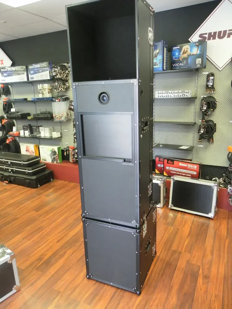 Narrow tower road case stacked three high with a speaker and control panel fitted