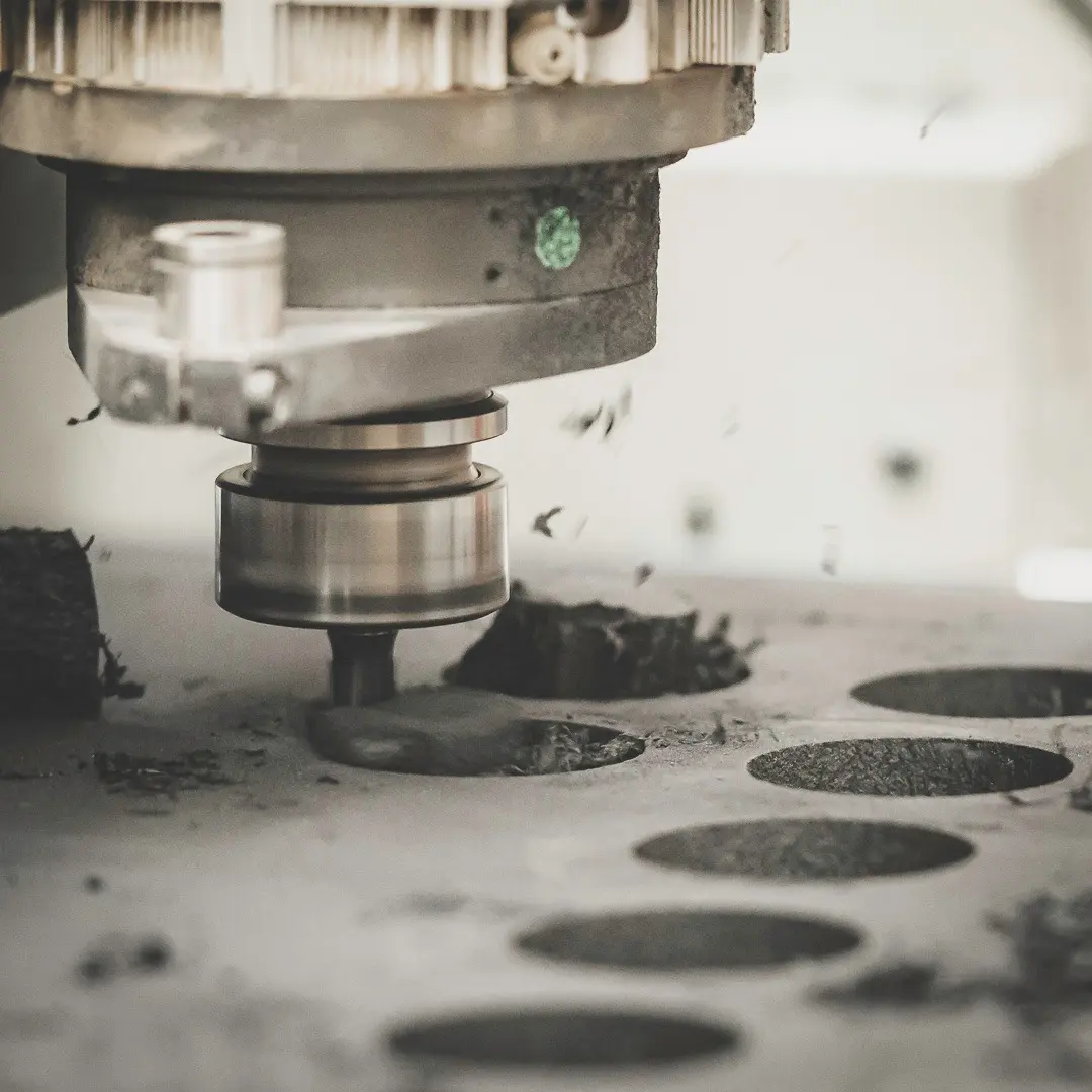 CNC router cutting a custom foam insert from black PE foam