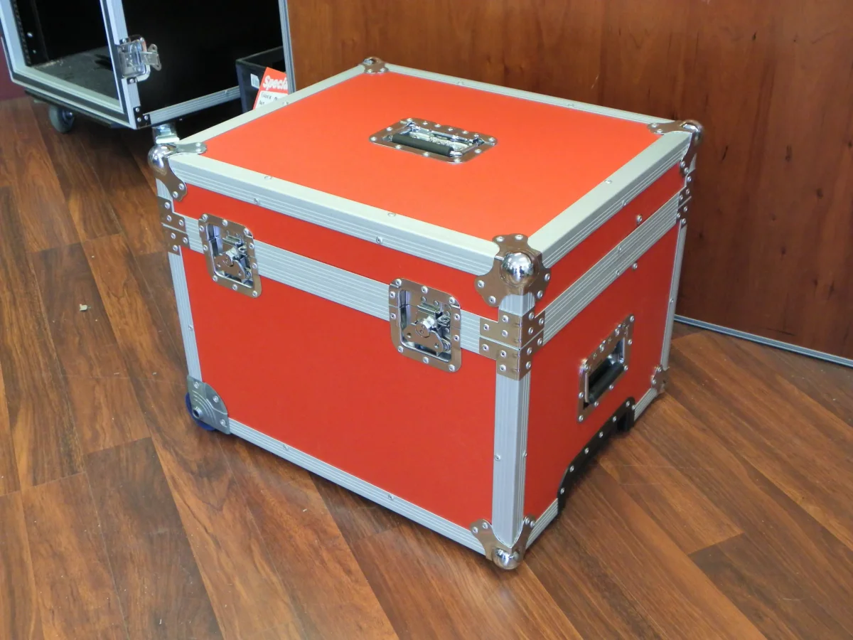 Orange flight case with aluminium extrusion, ball corners and recessed spring handles