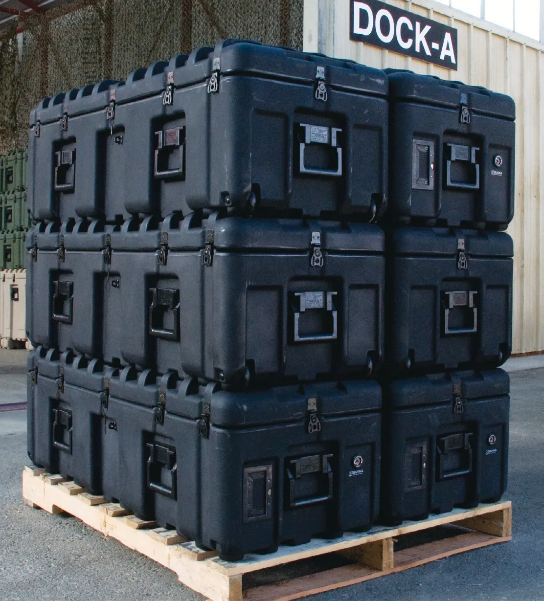 Pelican Hardigg ISP cases cross-stacked on a NATO pallet for military logistics