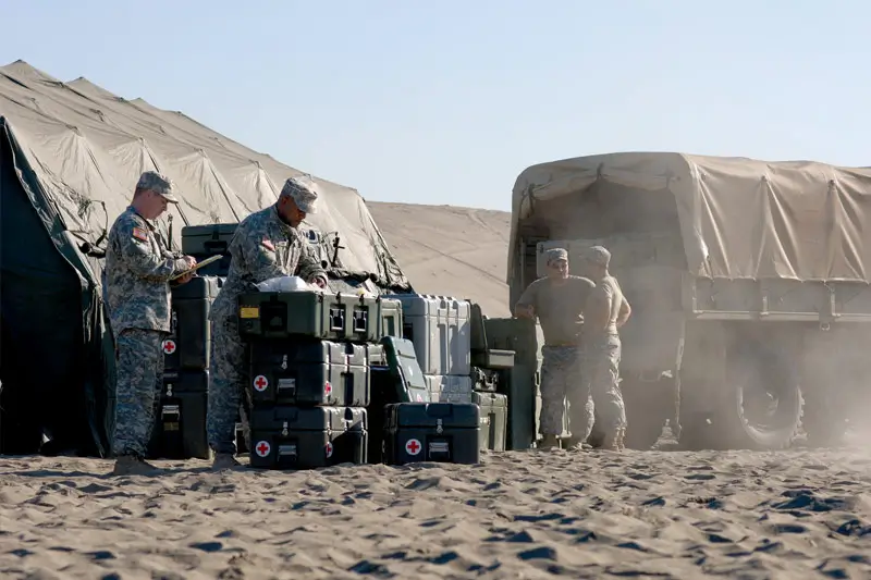 Pelican Hardigg ISP cases stacked on a military pallet